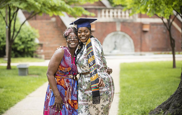 graduate with cap posing and smiling