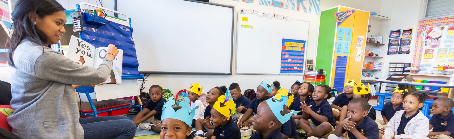 teacher in front of classroom speaking to class