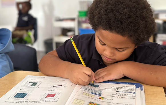 young student writing