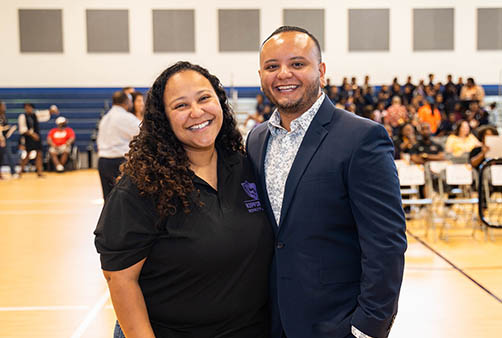 man and woman smiling and posing for photo