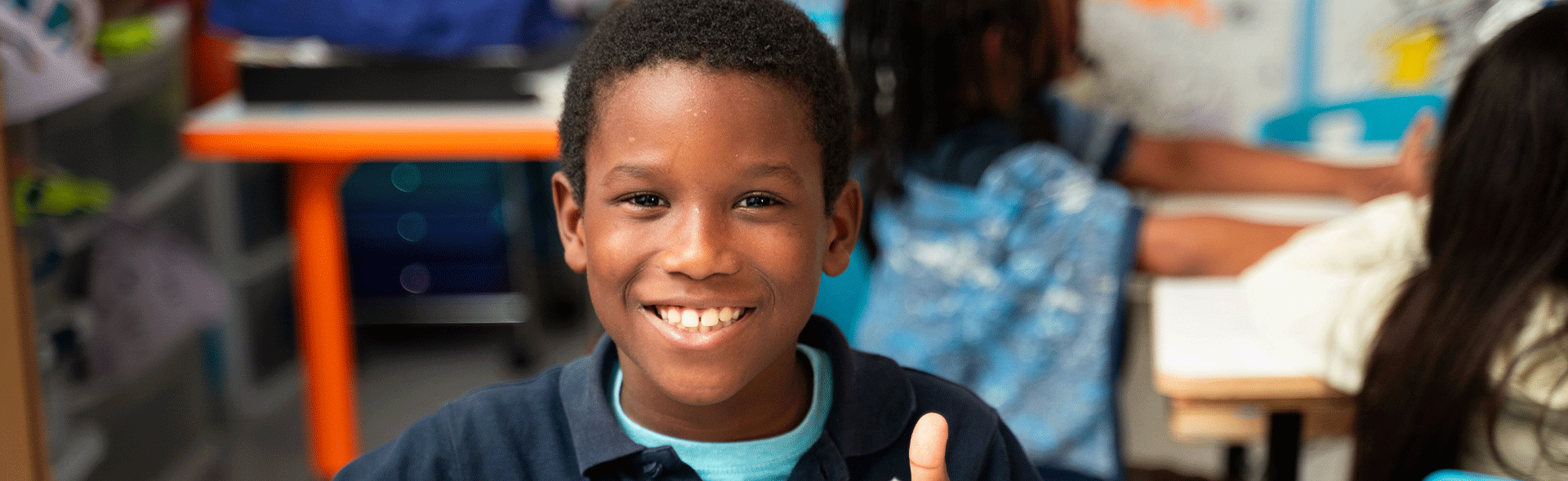 student smiling in classroom