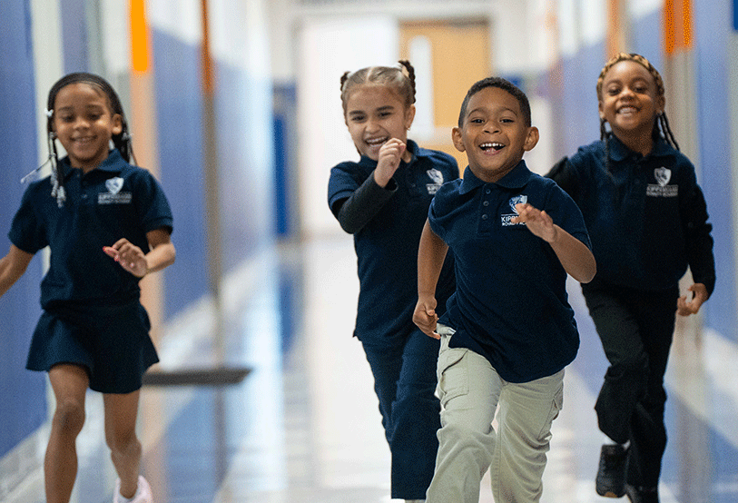 Four young students in hallway