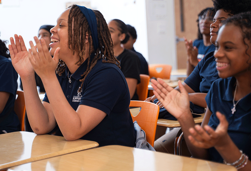 Students cheering in classroom